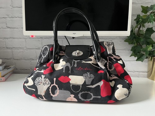 Lulu guinness cat logo - guinness,