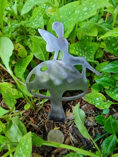 Metal fairy sitting a - metal,