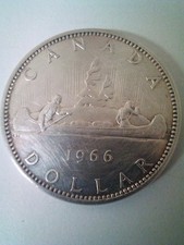 Canadian silver dollar coin with canoe dated 1966 excellent condition