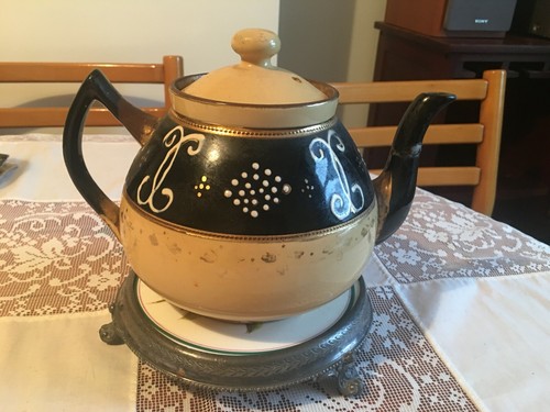 Antique teapot with metal - with,