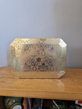 Empty decorative gold-toned