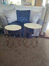 Next marble effect top with copper/rose gold geometric metal body nested tables