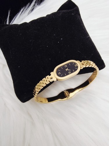 Gold roman dial bangle - roman,