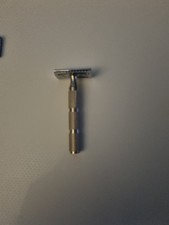 Safety razor With Stainless Steel Knurled Handle And Three Different Heads.