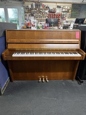 Schimmel upright piano. Comes