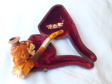 Meerschaum, a gorgeous cheroot holder carved as a lady sporting a big bow