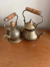 Two - Antique-metal-teapot