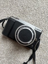 LUMIX Panasonic Camera Leatherbound With Strap & 3 Extra Lenses.