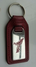 Rolls Royce orignal keyring 'Flying Lady/Spirit of Ecstasy' mounted on burgundy 