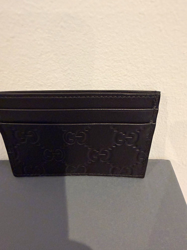 Gucci black leather embossed