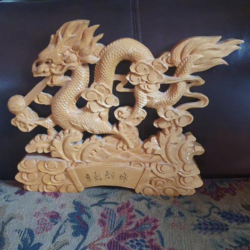 Dragon playing with - a, pearl