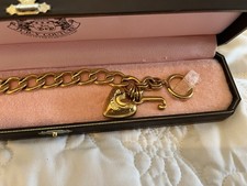 Juicy Couture Gold Tone Charm Bracelet. 20CM SIZE. IN BOX. GREAT CONDITION. 