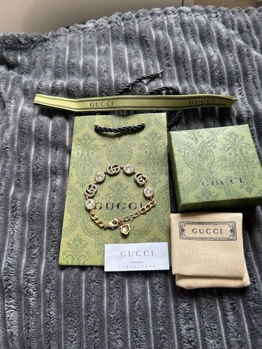 Gucci gold tone logo - gg, cable