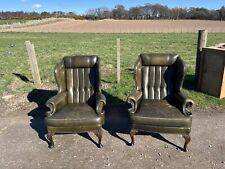 A Pair of Vintage Green Leather Chesterfield Wing Back Armchairs