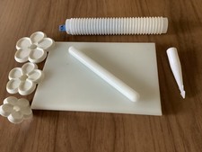 Sugarcraft tools used non stick board, roller, ribbed roller and flower cutters