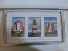 M WISCOMBE SEASIDE SCENE BEACH HUT, LIGHTHOUSE AND DECK CHAIR PRINTS IN 1 FRAME