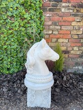 Stone horse head sculpture