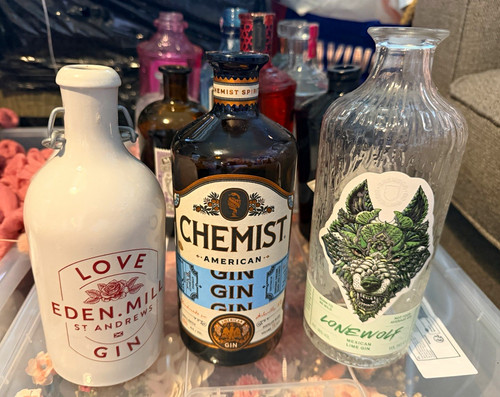 Empty gin bottles - empty,