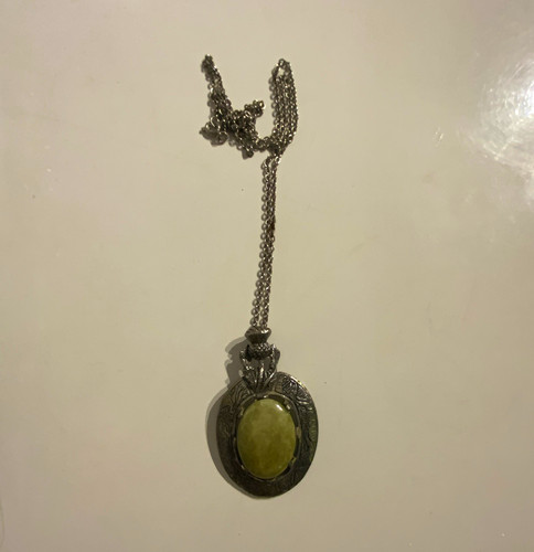 Silver tone oval locket - tone,