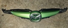 MAZDA 2 TAMURA 2010 FRONT BUMPER UPPER RADIATOR CENTRE GRILL & BADGE - DOIN50712