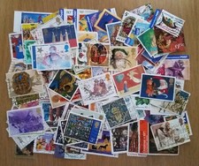 100 all different used Christmas themed postage stamps
