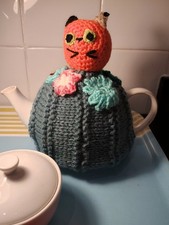 NEW HAND KNIT CAT  IN FLOWERS