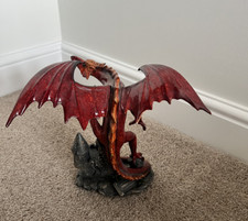 Red Glazed Nemesis Now Dragon standing on pewter coloured castle Ornament