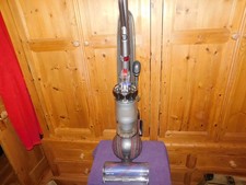 Silver Dyson Ball Animal upright vacuum cleaner.