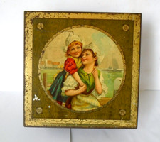 Vintage Old Tin Featuring a