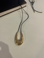 Cos Necklace Gold Tone U Shaped Pendant On A Black Cord