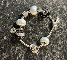 Rhona Sutton Sterling Silver Black and Pearl White Charm Bracelet.