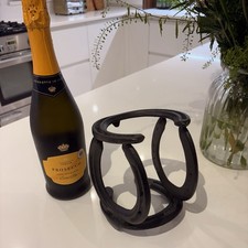 A Cast Iron Horse Shoe Wine Bottle Holder, Great Item For Equestrian Lovers