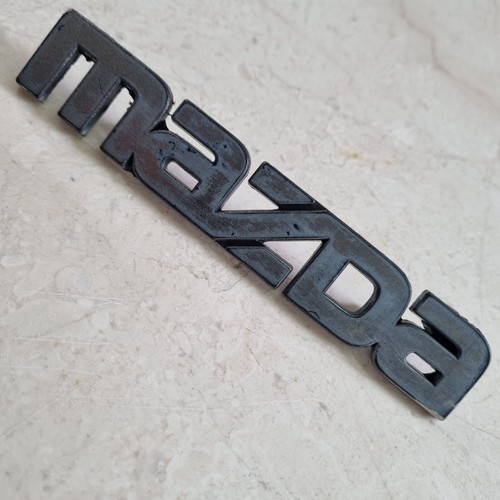 Mazda badge 1980 323 - mazda, etc