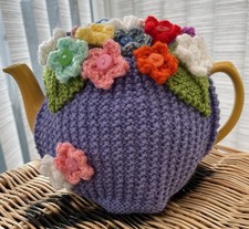 Hand Knitted Lavender Colour Tea Cosy With Flowers. Fits Medium Size Teapot