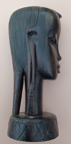 Solid dark wooden carving of - solid,