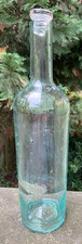 Old pressed glass bottle with