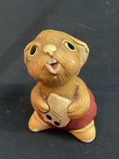 A vintage Pendelfin ceramic figurine of a rabbit named Rolly.