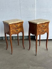 A pair of French mirror veneered and marble topped bedside tables