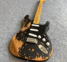 Old black ST electric guitar