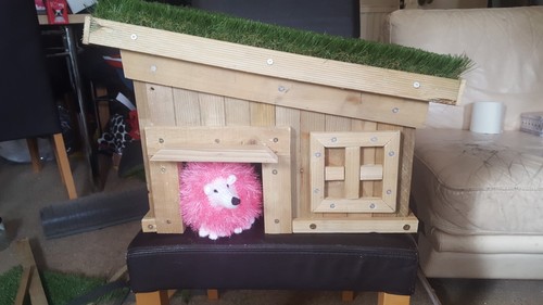 Handcrafted hedgehog log cabin