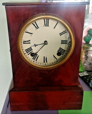 OLD MAHOGANY MANTLE CLOCK With swinging pendulum and strikes 35cm x 25cm x 12cm.