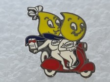 Esso Logo's ridding Vespa