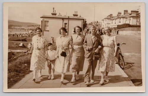 Family group walking promenade - family,