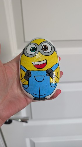 Hand painted pebble minion - hand,