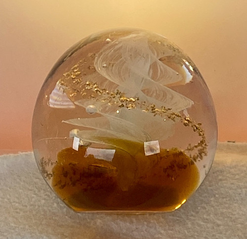 Round glass paperweight with - round,