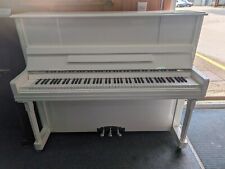 White Polyester upright piano.  Modern, very young.