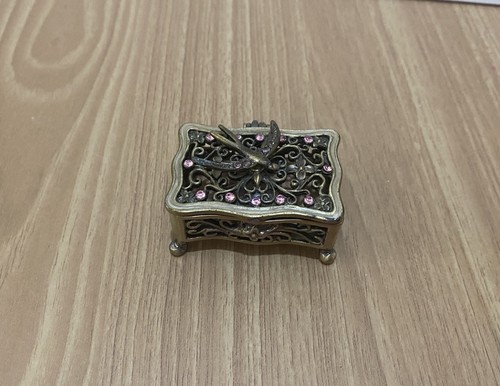 Delicate bronzed filigree bird