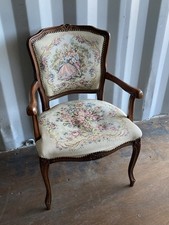 vintage French Louis XV style armchair featuring needlepoint tapestry upholstery