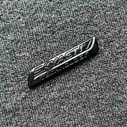 Gloss black rear trunk emblem - rear,