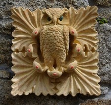 The Tudor Gate Owl of Minerva in Farran Stone with green verdigris eyes.